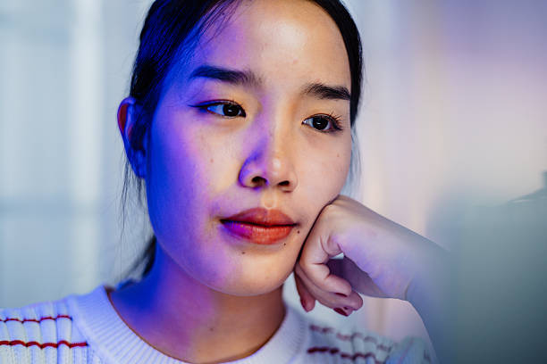 istock Asian female freelancer working online on laptop with determination 2225035226