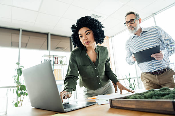 istock Professional business team collaborating in a modern office environment with diverse colleagues discussing ideas and projects 2225037799