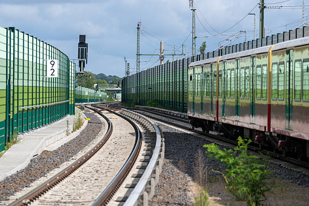 Railroad track with a level crossing near a small town