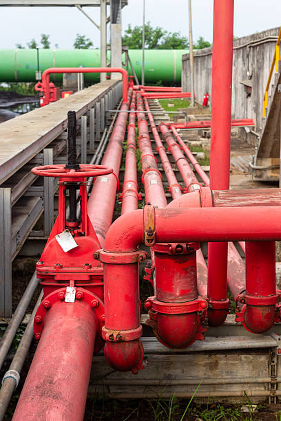 istock Complex industrial pipeline system showcasing intricate network of red pipes and valves 2225042342