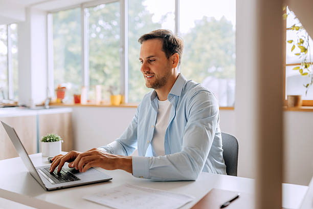 istock Remote employee working on laptop from home 2225044403