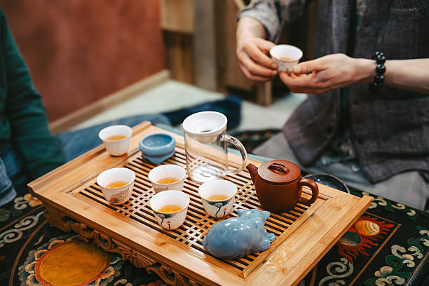 istock Hands Holding Tea Cup During Traditional Ceremony 2225047486