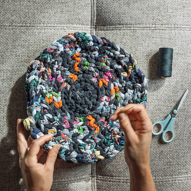 istock Top view of sewing recycled fabric rug 2225049188