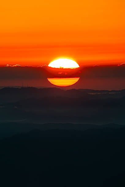istock The sun rises in the morning as clouds pass through the middle. 2225050506