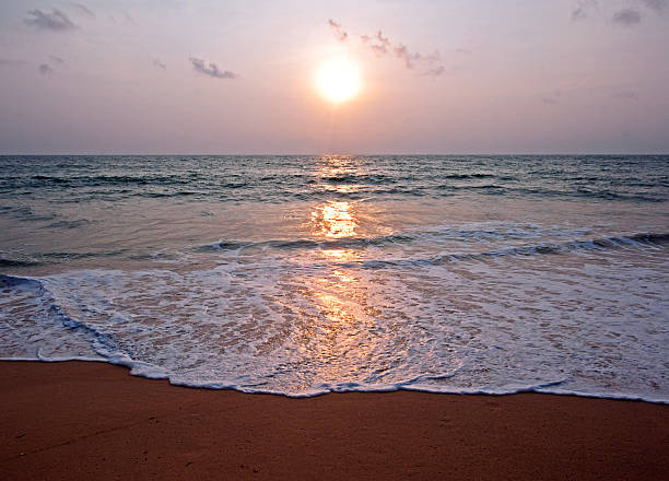Sunset over sea, Balapatiya beach, Sri Lanka. Balapitiya coastal town, Southern Province. Sri Lanka is the tropical Indian Ocean island formerly known as Ceylon, situated off the southeastern tip of India, renowned for its tea, rubber and precious stone production throughout the world.