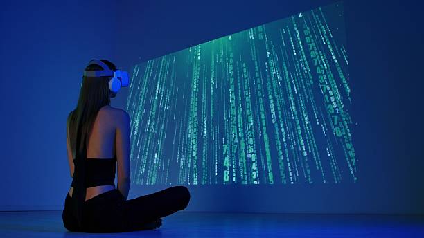 istock Woman Engaged in Virtual Reality Experience with Digital Matrix Projection 2225051913