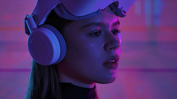 istock Woman Engaging with Virtual Reality Headset and Abstract Background 2225052109