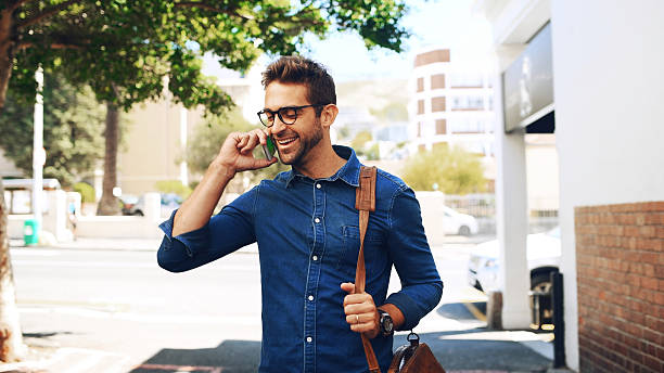 istock Phone call, commute and man travel with communication, connection or chat. Happy, creative person with smartphone, networking and contact with mobile conversation for internship opportunity in city 2225059172