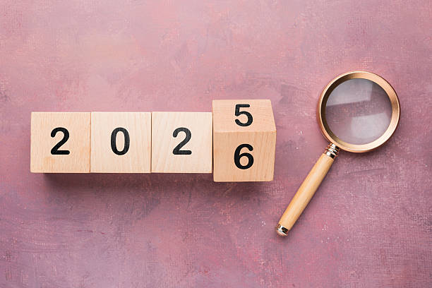 istock Turning Year 2025 to 2026 with Magnifying Glass 2225059357