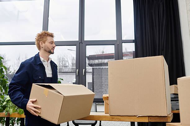 istock Moving boxes in a contemporary office space while packing personal belongings for relocation 2225060743