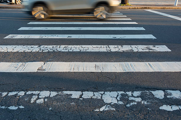 istock Blurred car speeding through a pedestrian crossing. Traffic sign. 2225061515