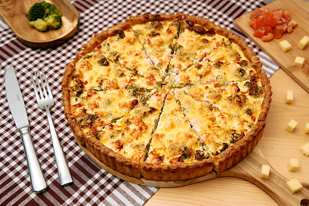 istock Cheesy broccoli salmon quiche with golden crust on checkered tablecloth for savory brunch ideas 2225062103