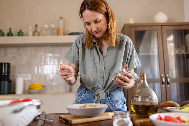 istock Woman cooking in a cozy kitchen 2225062649