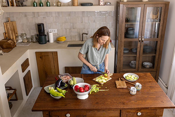 istock Woman cooking in a cozy kitchen 2225063277