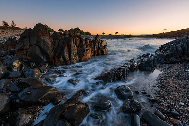 istock Sunrise at rocky coastline 2225063333