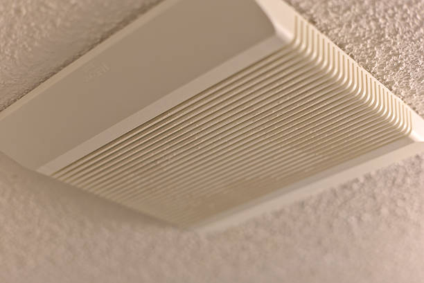 istock Side View of Dirty Ceiling Fan Vent in Bathroom 2225063561