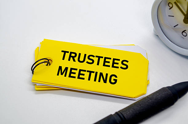 istock Trustees Meeting notepad with keyring on yellow background 2225063855