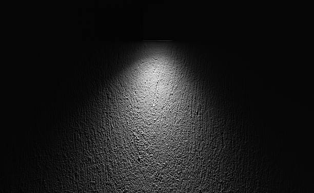 istock A focused spotlight highlighting the texture of a rough wall surface 2225064877