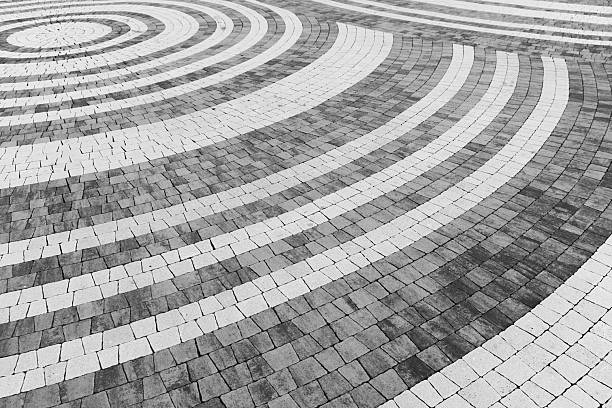 istock Artistic pattern of concentric white circular lines, decorative stone pavement 2225064878
