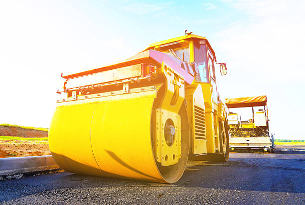 Close up of road construction rollers in action
