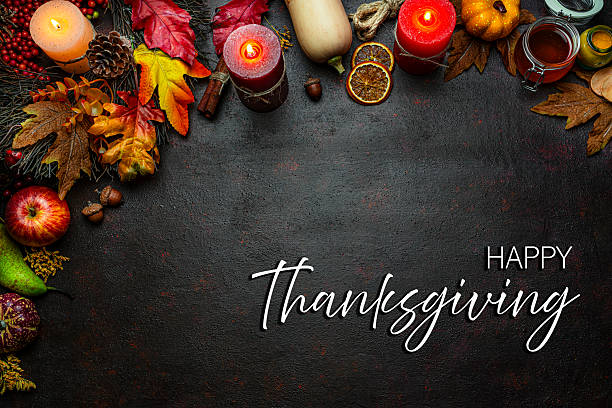 istock Autumn or Thanksgiving border. Decor with burning candles, fallen leaves, nuts, cinnamon sticks and pumpkin. Greeting card or copy space. October or season. Happy Thanksgiving concept 2225066617