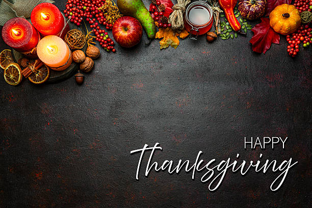Autumn or Thanksgiving border. Decor with burning candles, fallen leaves, nuts, cinnamon sticks and pumpkin. Greeting card or copy space. October or season. Happy Thanksgiving concept