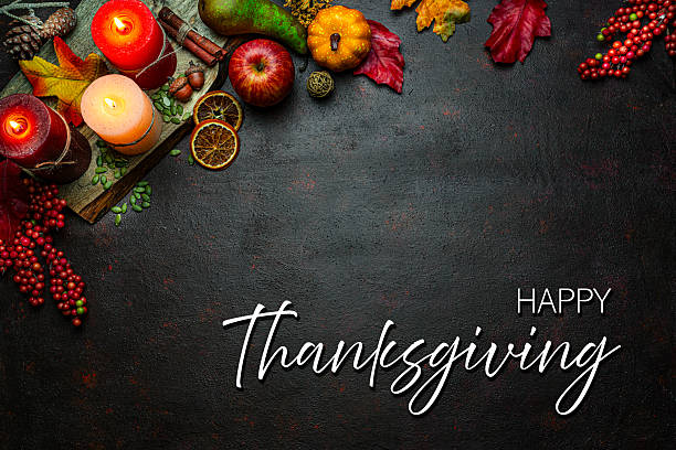 istock Autumn or Thanksgiving border. Decor with burning candles, fallen leaves, nuts, cinnamon sticks and pumpkin. Greeting card or copy space. October or season. Happy Thanksgiving concept 2225066624