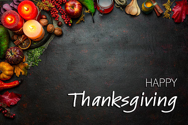 istock Autumn or Thanksgiving border. Decor with burning candles, fallen leaves, nuts, cinnamon sticks and pumpkin. Greeting card or copy space. October or season. Happy Thanksgiving concept 2225066670