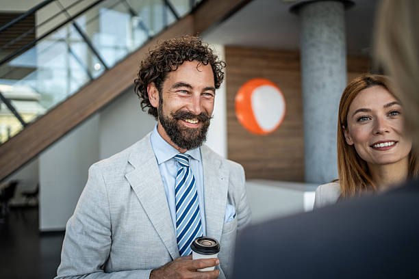 istock Business people talking during coffee break in office lobby 2225066833