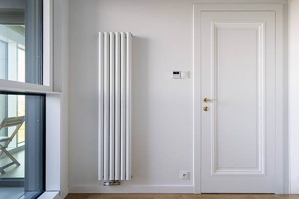 istock Modern electric heater and programmable thermostat in a stylish living space 2225069010
