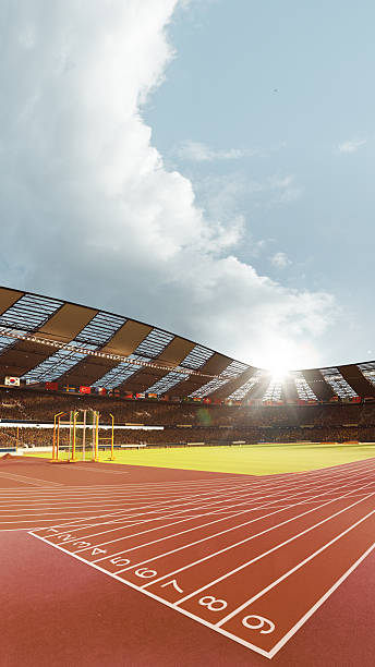 istock 3D running track and empty lanes in sunlight with roofed stadium 2225070063