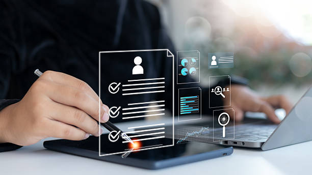 istock HR professional analyzing a digital resume on tablet with data charts and AI elements, concept of smart recruitment, online hiring, and data-driven decision-making. 2225072915
