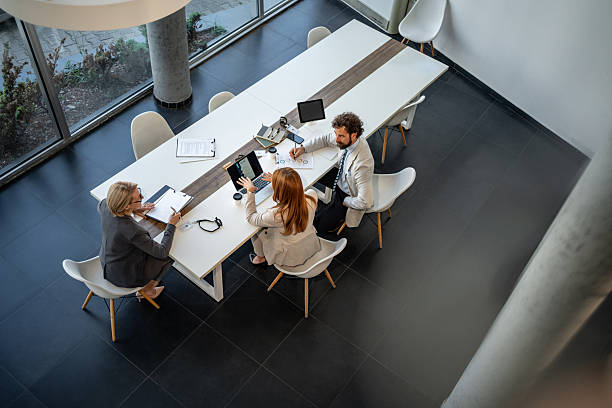 istock Business team analyzing data on laptop during meeting in modern office 2225077137