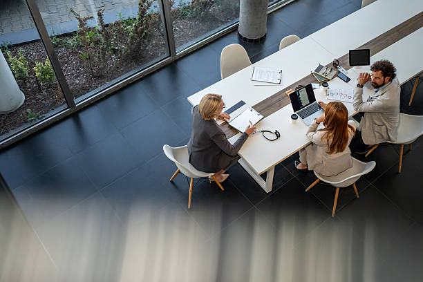 istock Business people working together at meeting table in modern office 2225077146