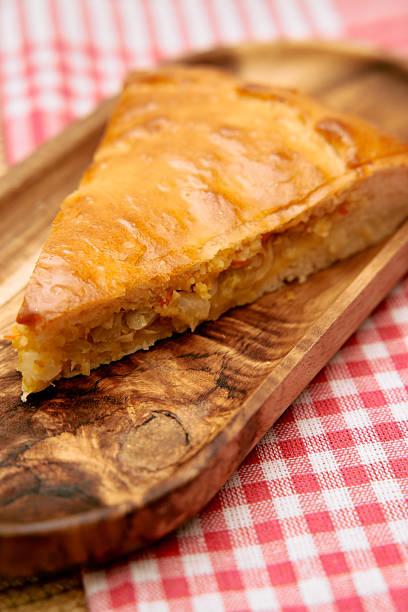 istock Savory pumpkin pie slice on wooden tray with checkered tablecloth 2225077181
