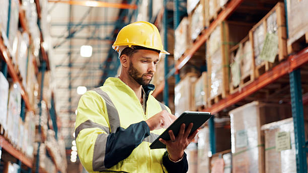 istock Man, tablet or distribution with inspection at plant, shipping information scroll or schedule for quality control. Logistics, supplier or delivery report on tech for inventory management at warehouse 2225077927