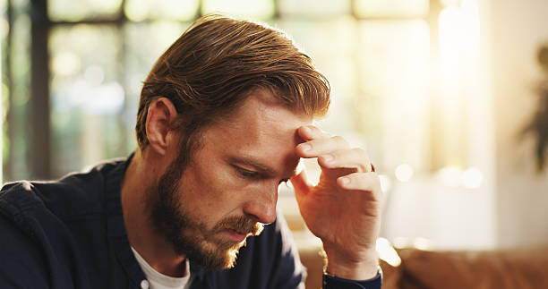istock Stress, man and thinking with worry at house for bad decision, financial crisis or reflection. Disappointed, person or wonder for bankruptcy risk, remember mistake and regret choice with debt concern 2225080126