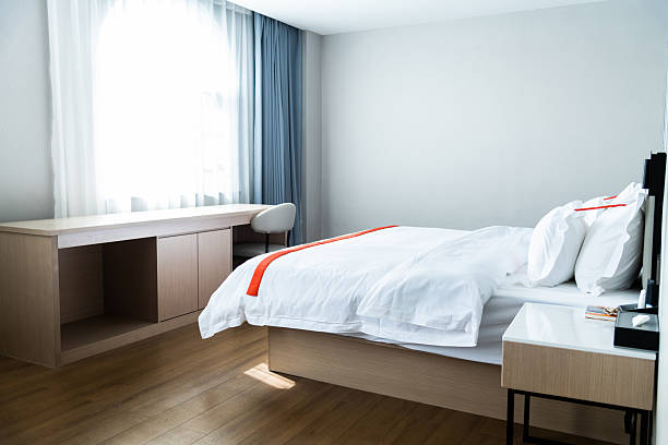 istock White bed with pillows in modern bedroom 2225082751