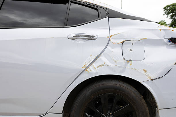 istock Broken car side mirror after accident, white vehicle with damaged wing mirror and raindrops on door panel 2225084201