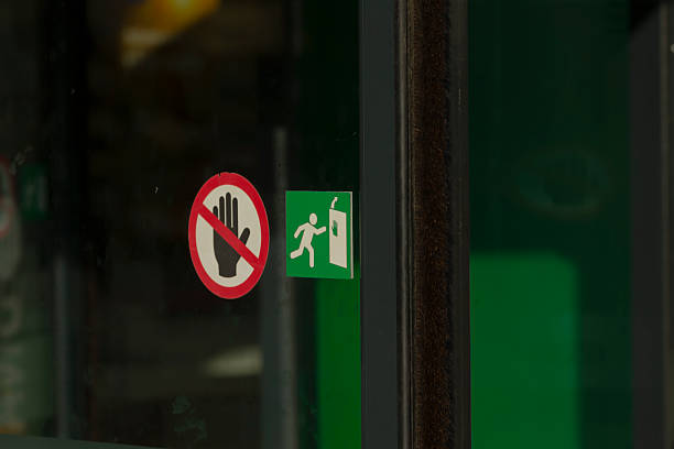 istock Safety Signs on Building Entrance - No Entry and Emergency Exit 2225084346
