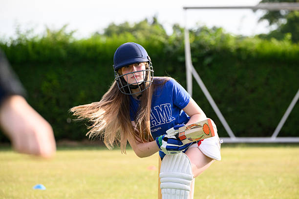 istock Young female batter taking a shot with cricket bat 2225085485