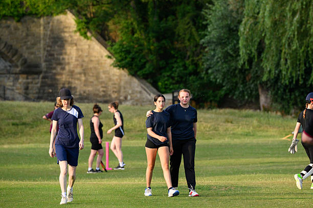 istock Supportive team members walking together arm around shoulder on sports field 2225086455