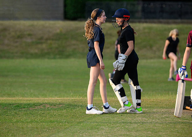 istock Female wicketkeeper chatting to fielder during cricket match 2225086525
