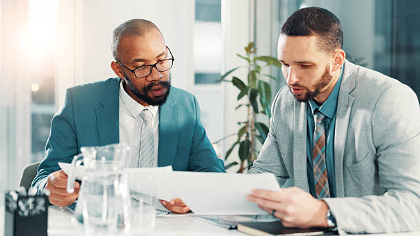 istock Teamwork, meeting and documents with business people in office for project proposal, account advisor or planning. Budget adviser, company treasurer and brainstorming with employees for revenue review 2225086618
