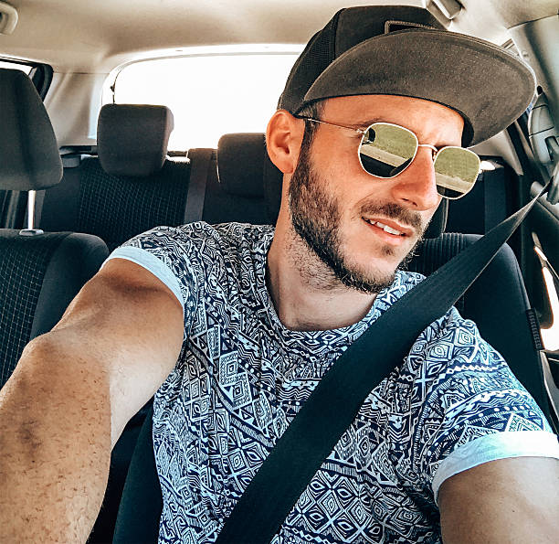 istock man take a selfie on the car 2225087625