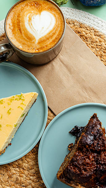 istock Cappuccino, cheesecake and chocolate cake served on a table 2225088639