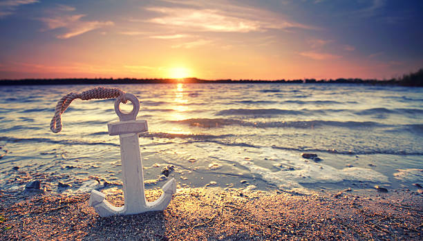 istock Timeless Anchor: A Weathered Wooden Relic at Sunset Shore 2225090604