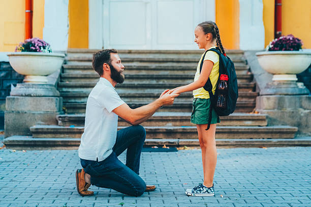 istock Father leaving daughter on her first day at school 2225094064