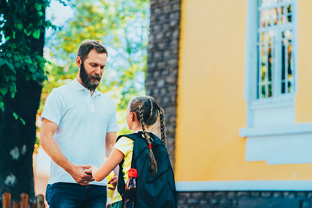 istock Father leaving daughter on her first day at school 2225094202