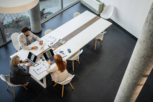 istock Business team working on laptops in modern office 2225094773